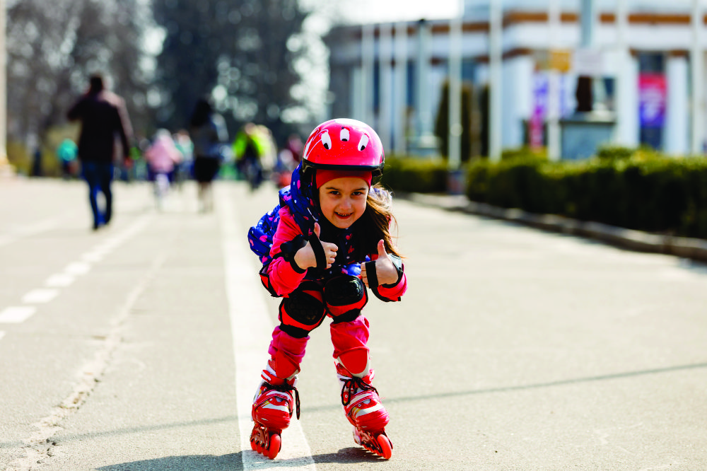young-happy-skater-trying-exciting-outdoor-activity